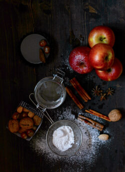 Apple still life with baking ingredients from directly above