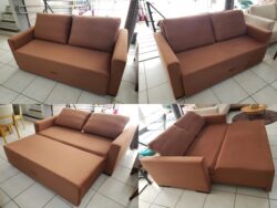 Brown modular sofa with wide arms on a tiled showroom floor, cushions against backrests—displayed from multiple angles.